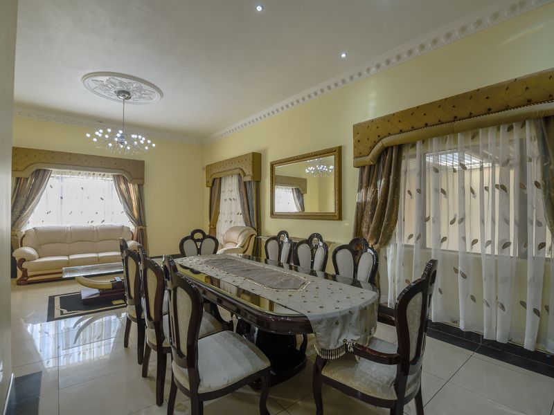 Exquisite 5-Bedroom Family Home with Premium Features - Photo 9