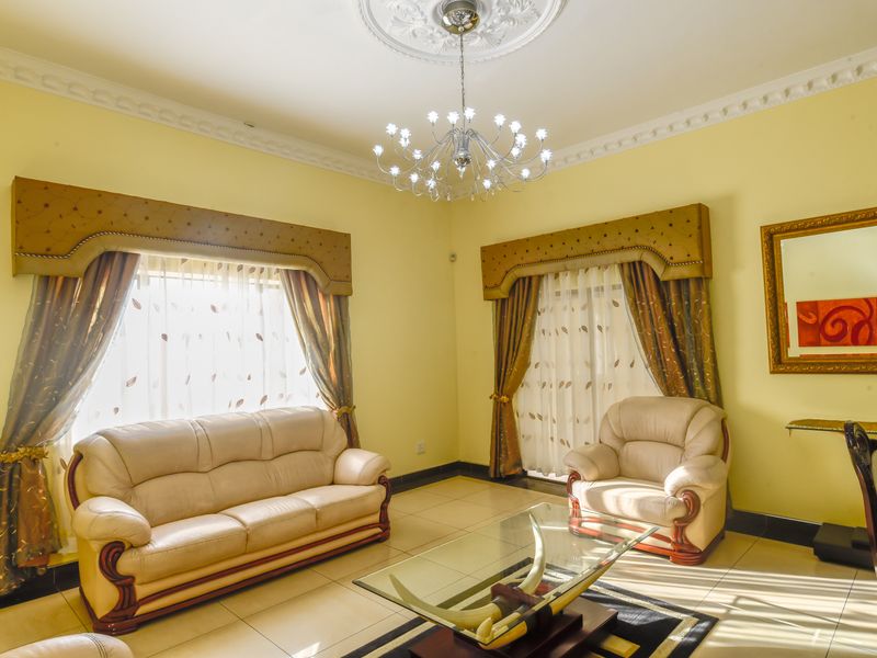 Exquisite 5-Bedroom Family Home with Premium Features - Photo 8