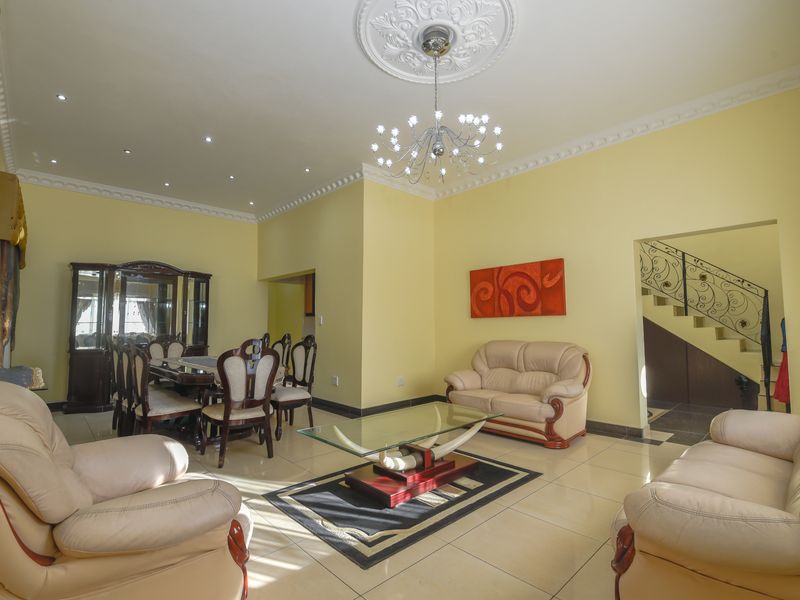 Exquisite 5-Bedroom Family Home with Premium Features - Photo 7