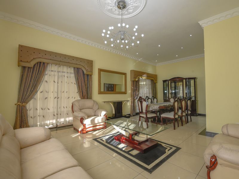 Exquisite 5-Bedroom Family Home with Premium Features - Photo 6