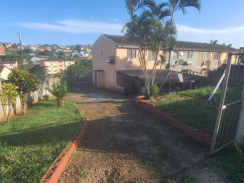 Three Bedroom Corner Property with Huge Yard and Two Road Access - Photo 1