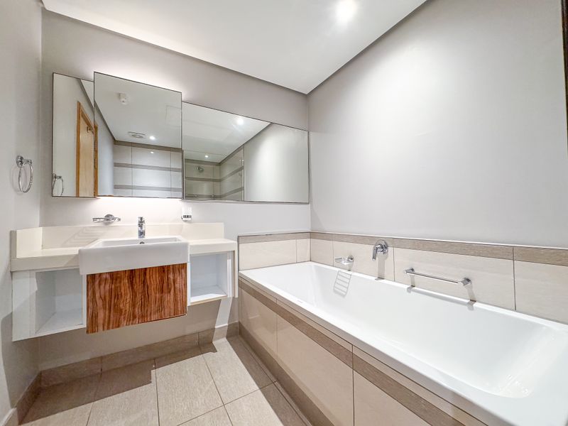 Luxury Coastal Living | Spacious 3 Bed 3 Bath Apartment at Pearls - Photo 9