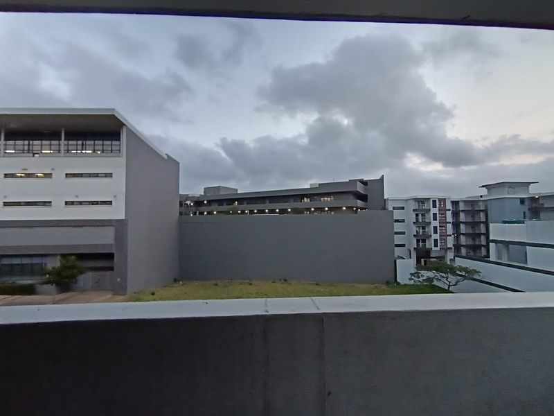 An elevated view overlooking surrounding apartment buildings and urban landscape.