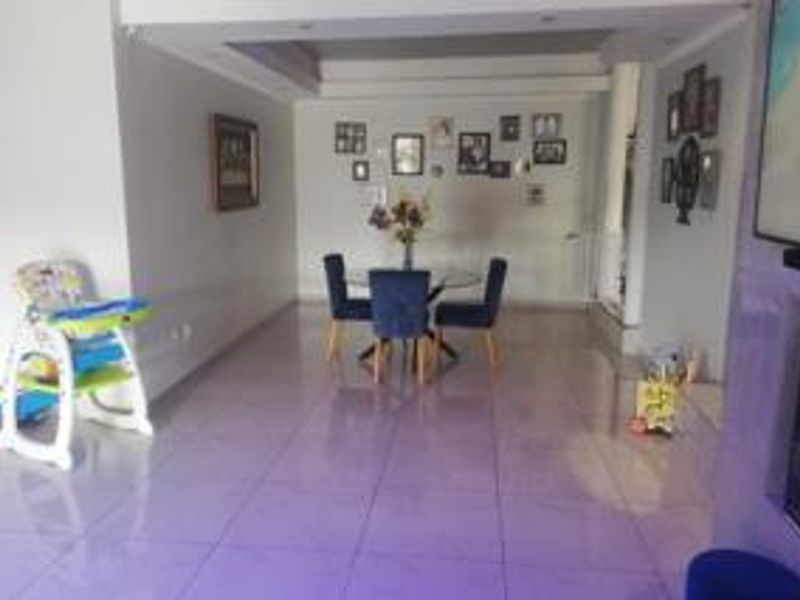 Open plan living and dining area featuring tiled flooring and recessed ceiling lighting, providing a versatile space for family living.