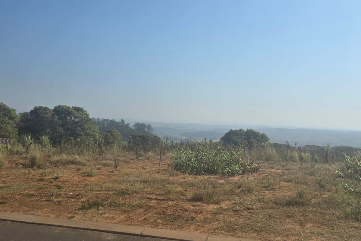 A scenic view overlooking the natural landscape and surrounding terrain from the vacant residential property.