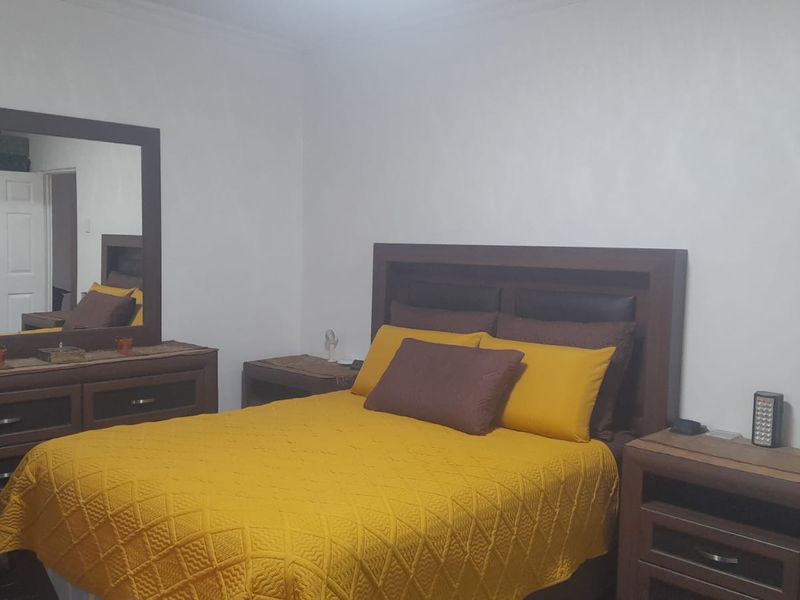 A standard bedroom featuring neutral wall finishes and basic interior door access.