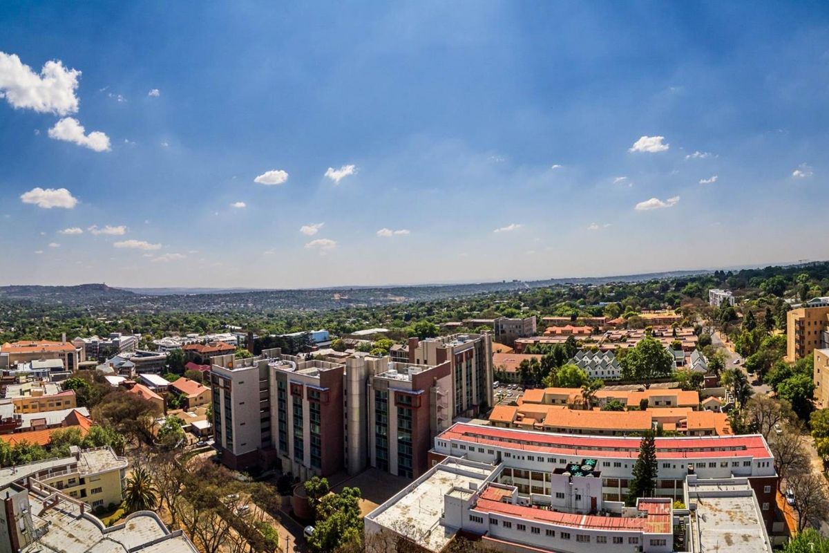 An elevated aerial view showcasing the surrounding urban landscape and neighborhood infrastructure.