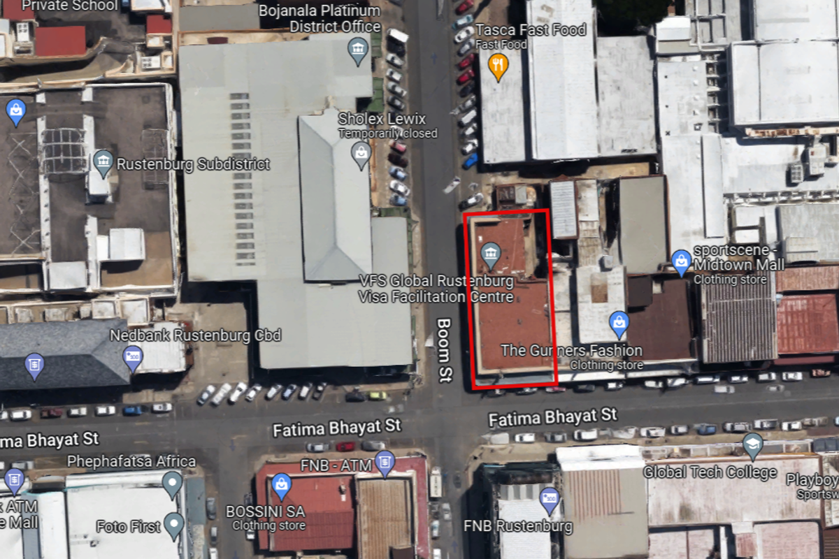 An aerial view showing the commercial property footprint located in a central business district area.