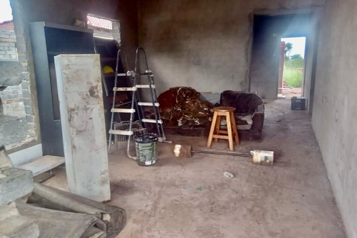 An unfinished interior space featuring raw concrete walls and flooring, offering a blank canvas for complete renovation and custom interior design.