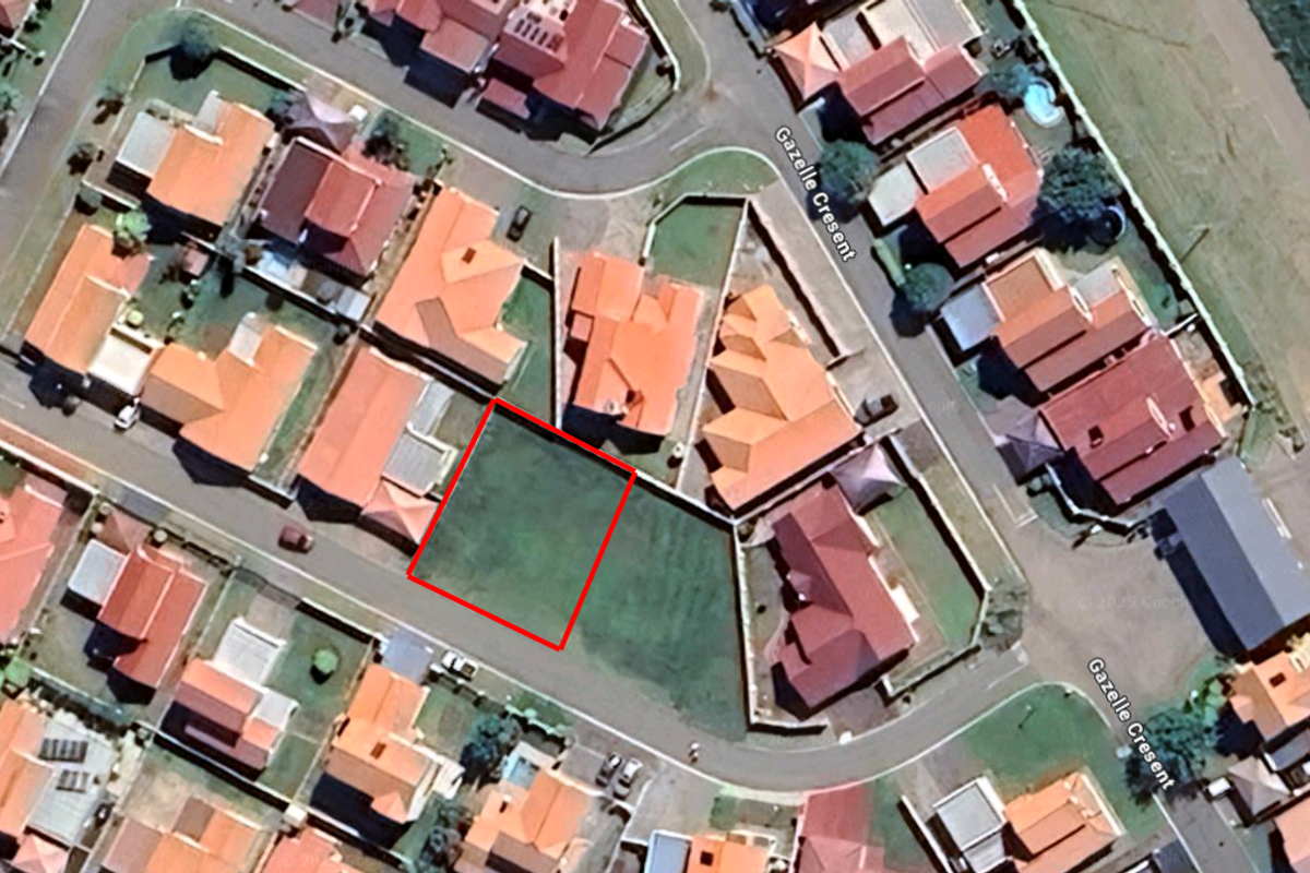 Aerial view of a vacant residential land plot situated within a developed suburban neighborhood on Gazelle Crescent.