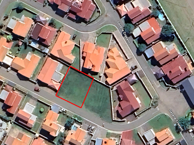 Aerial view of a vacant residential land plot situated within a developed suburban neighborhood on Gazelle Crescent.