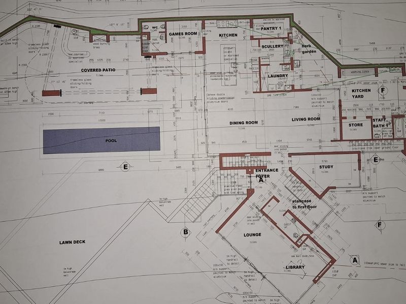 A detailed architectural floor plan showing the layout of the residential property, including living areas, kitchen, bedrooms, and outdoor spaces.