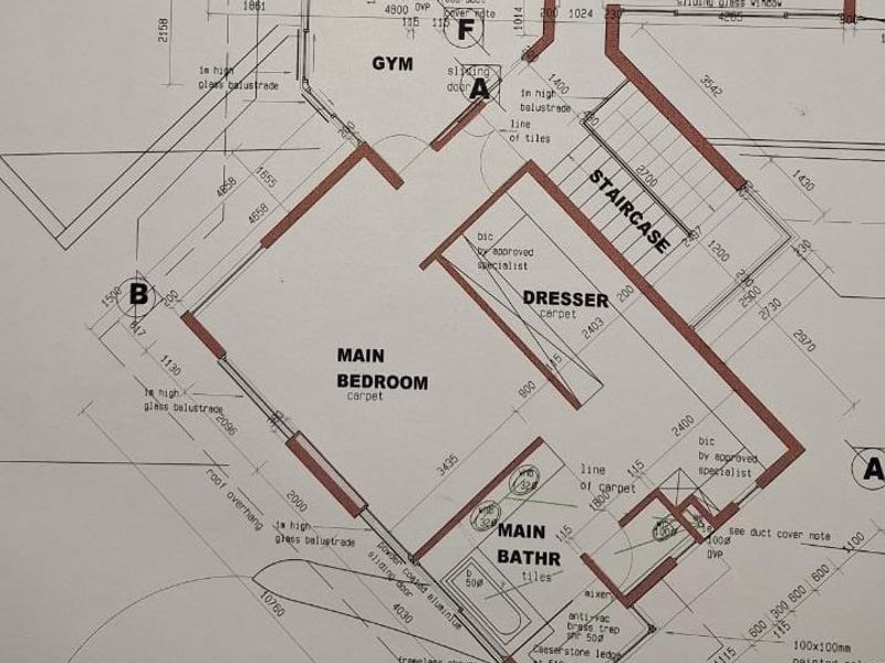 Architectural floor plan detailing the layout of the main bedroom, en-suite bathroom, dressing area, staircase, and gym space.
