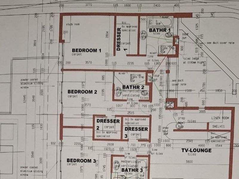 Architectural floor plan detailing the layout of bedrooms, bathrooms, dressing areas, and a TV lounge.
