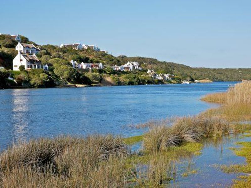 A scenic view of the river and surrounding landscape, showcasing the natural beauty and coastal environment of the residential area.