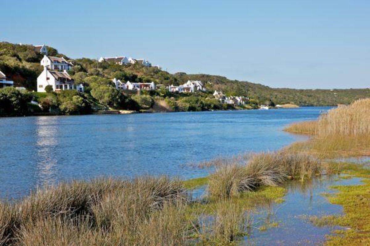 A scenic view of the river and surrounding landscape, showcasing the natural beauty and coastal environment of the residential area.