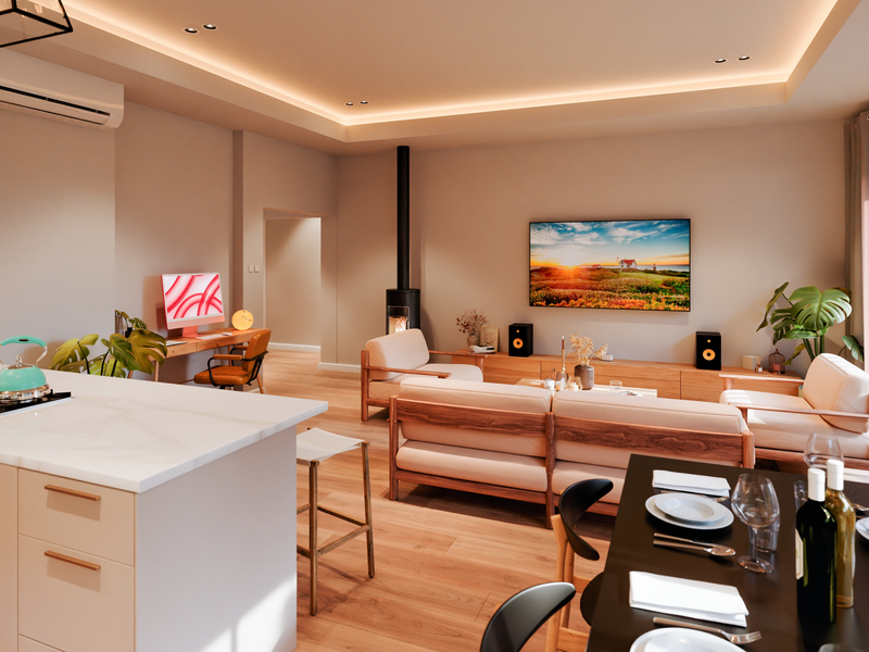 Modern open-plan living area featuring a sleek kitchen island, integrated appliances, a cozy fireplace, and seamless access to the outdoor space via sliding doors.