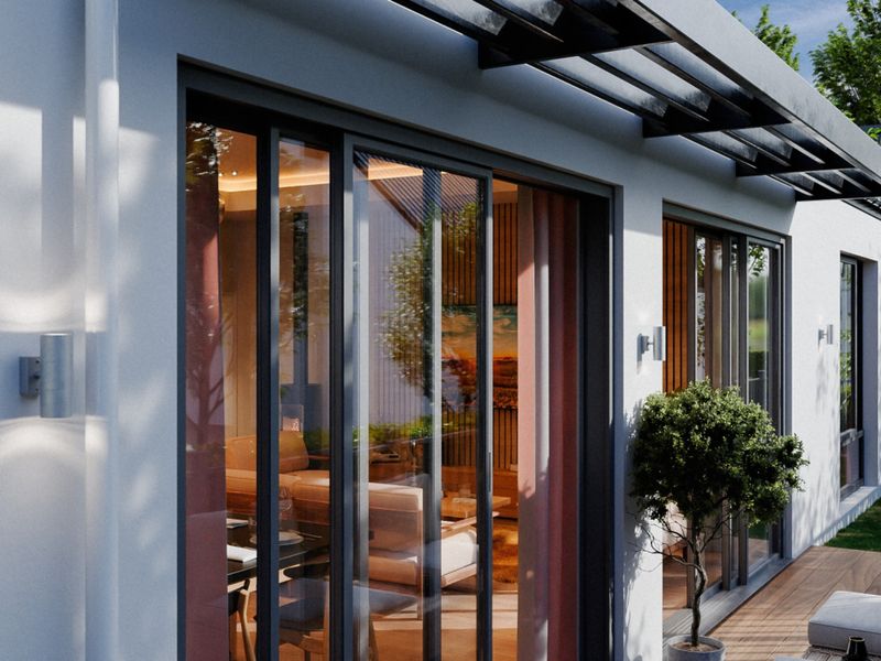 Modern patio area featuring timber decking, sleek sliding glass doors, and contemporary wall-mounted exterior lighting.