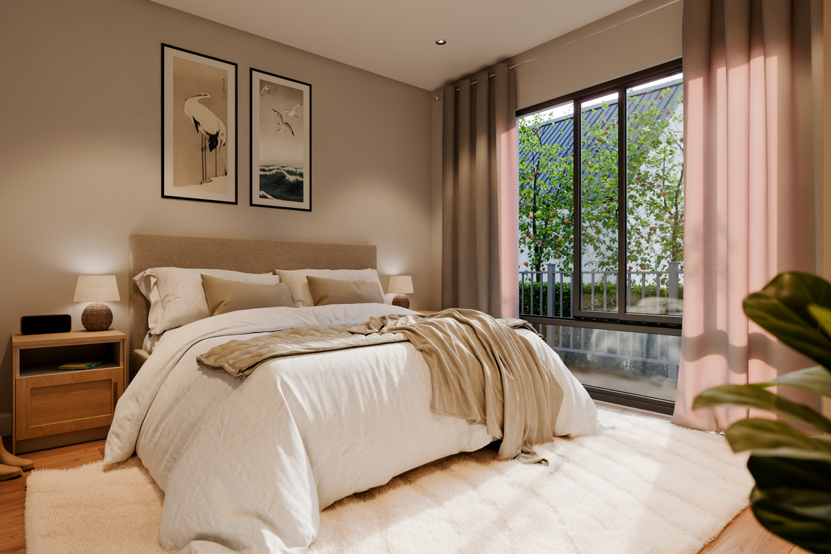 A well-lit, modern bedroom featuring hardwood flooring, recessed lighting, and a large sliding glass door providing natural light and garden views.
