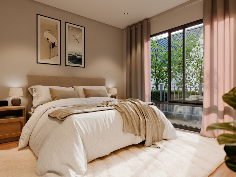 A well-lit, modern bedroom featuring hardwood flooring, recessed lighting, and a large sliding glass door providing natural light and garden views.