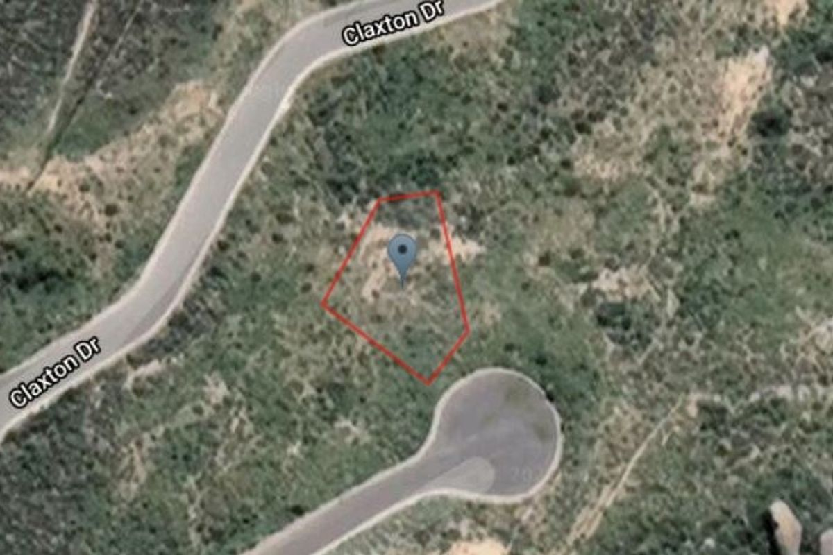 Aerial view showing the vacant residential land parcel outlined in red, situated near Claxton Drive.
