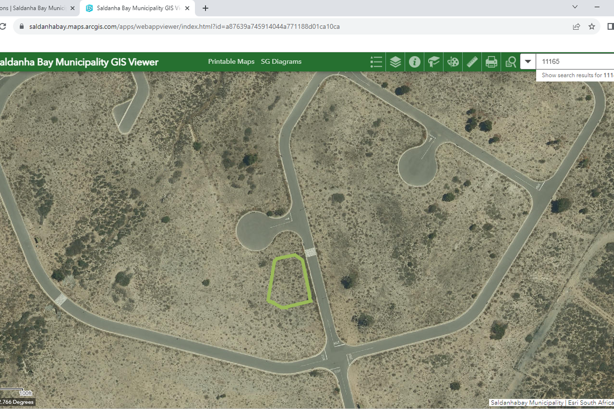 An aerial view from a GIS mapping tool showing the location and boundary of a vacant residential plot within a suburban street layout.