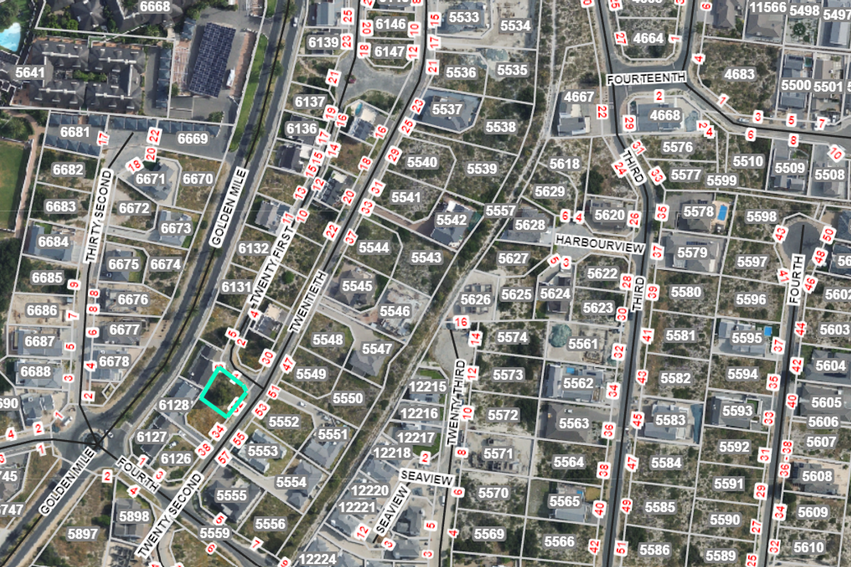 An aerial view of the residential estate showing the specific vacant land plot highlighted within the surrounding street and property layout.