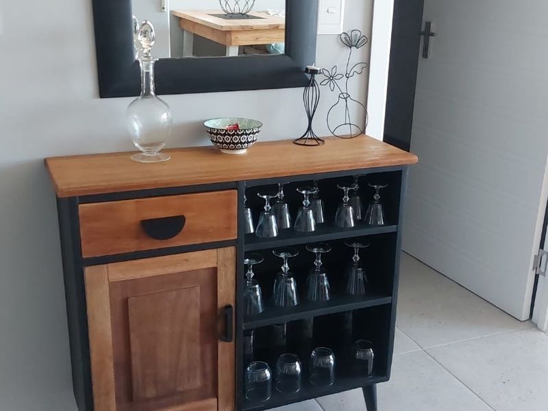 A well-maintained hallway area featuring neutral tiled flooring and clean wall finishes, providing a functional transition space within the flat.