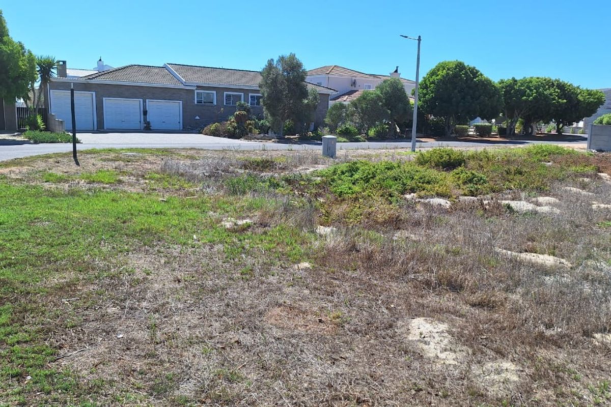 A vacant residential plot of land situated in a developed neighborhood with established street infrastructure and surrounding residential properties.