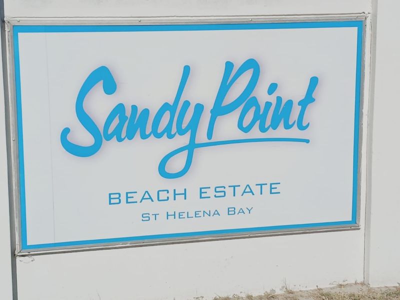 A clear signage board identifying the Sandy Point Beach Estate in St Helena Bay.