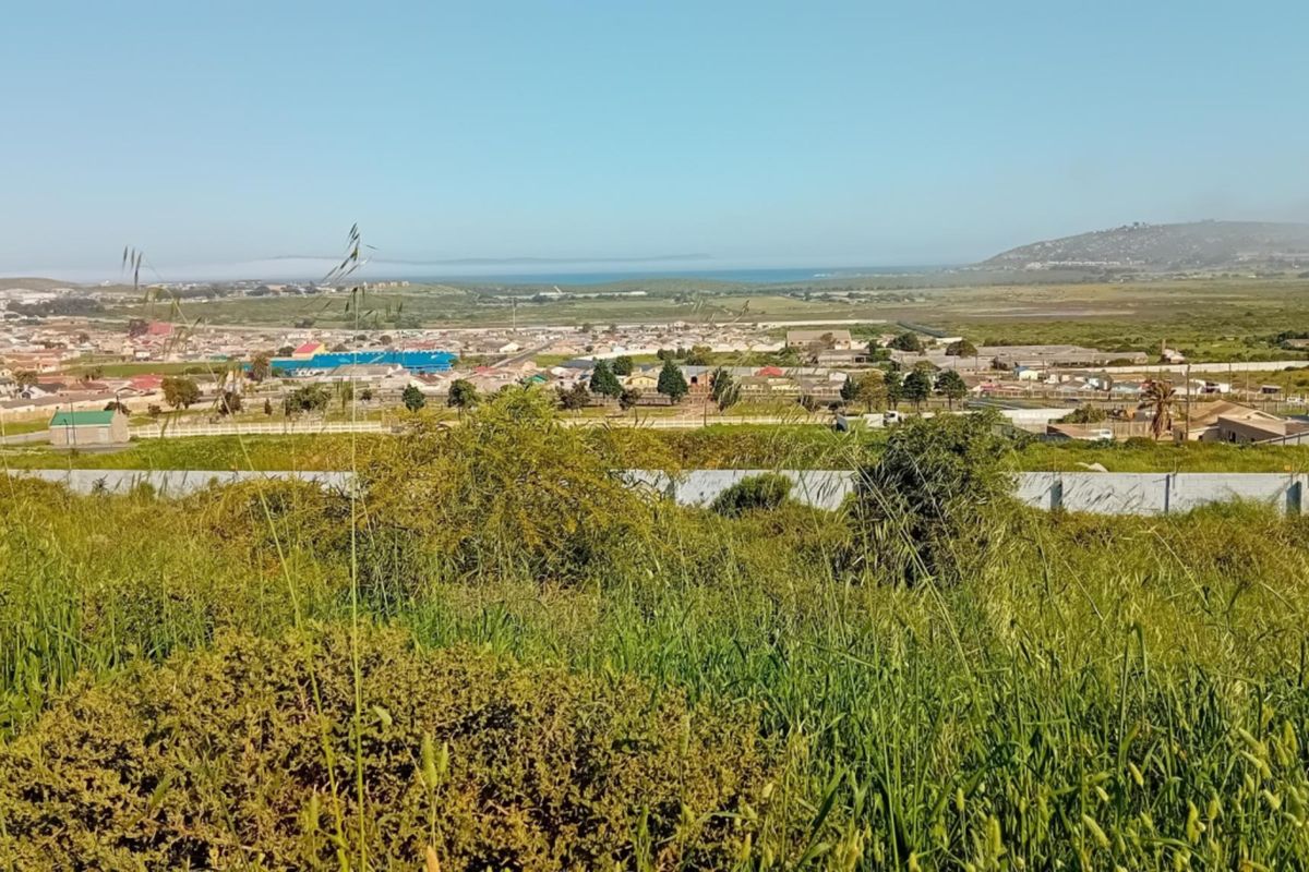 A scenic elevated view overlooking the surrounding residential landscape and distant coastline.