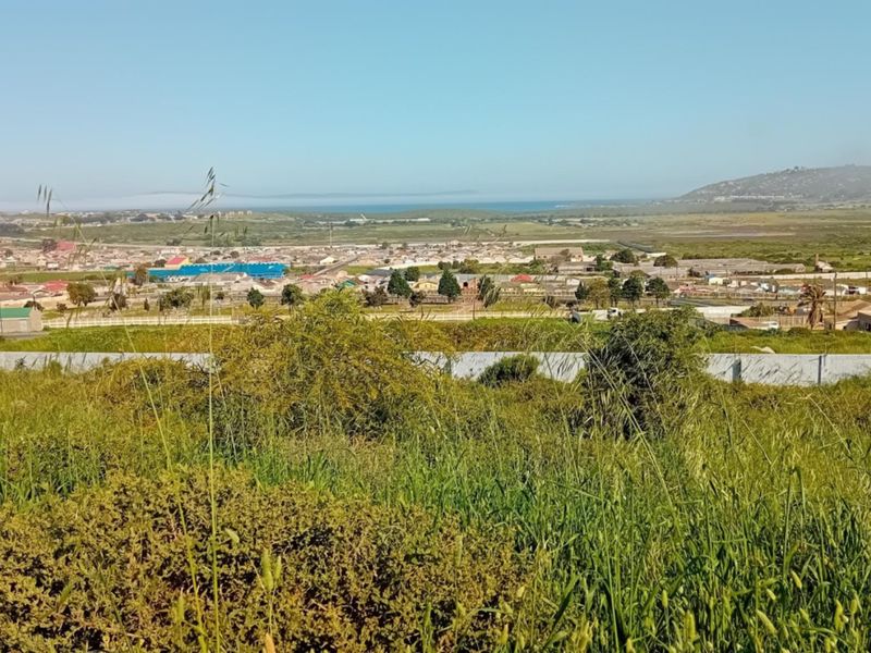 A scenic elevated view overlooking the surrounding residential landscape and distant coastline.