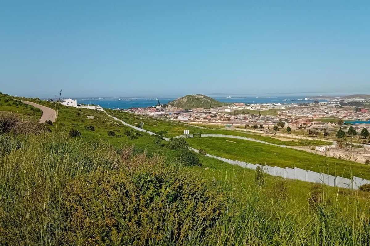 An elevated aerial view of the vacant residential land, showcasing the surrounding landscape, coastal proximity, and local neighborhood infrastructure.