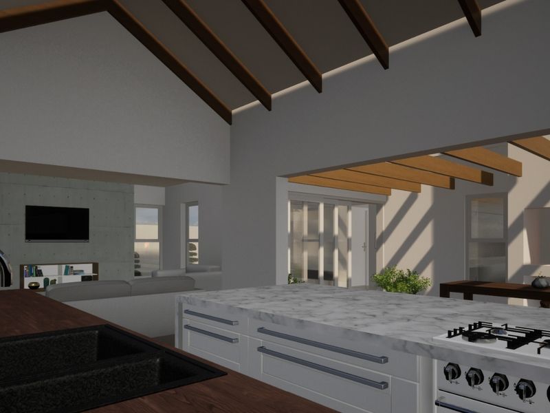 Spacious open-plan living area featuring a modern kitchen with marble island, vaulted ceilings with exposed beams, and a cozy built-in fireplace.
