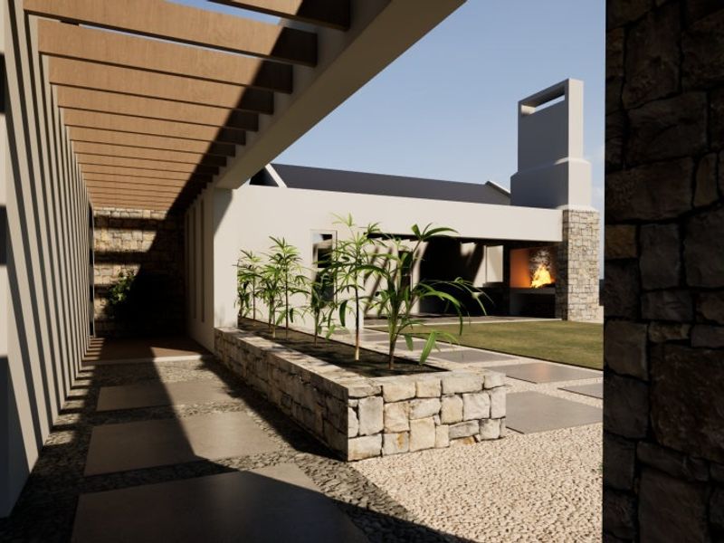 A modern outdoor patio area featuring a timber pergola, stone-clad built-in fireplace, and a stone planter box, creating a sophisticated entertainment space.