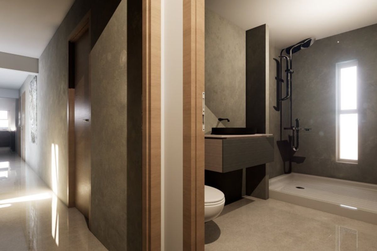 A modern, minimalist bathroom featuring a walk-in shower, wall-mounted vanity with a vessel sink, and sleek grey finishes, viewed from an adjacent hallway.