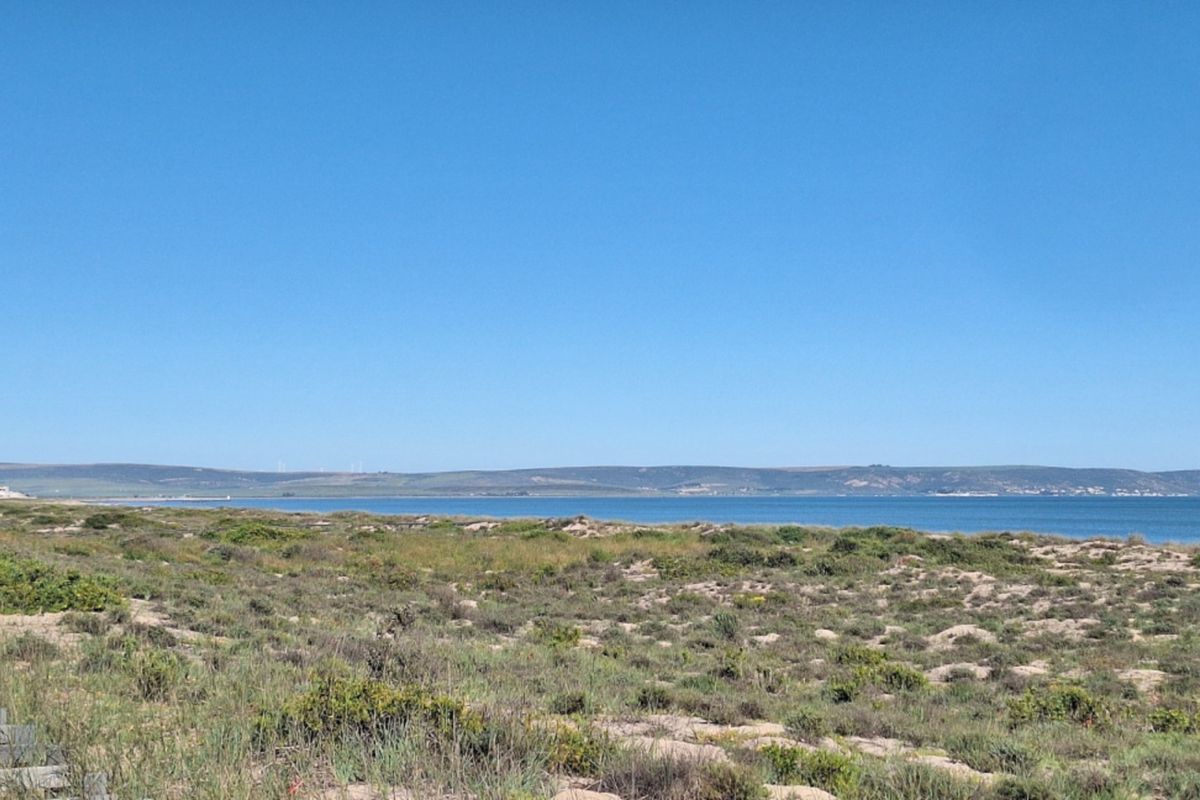 A scenic view of the coastline and ocean, showcasing the natural landscape and horizon.