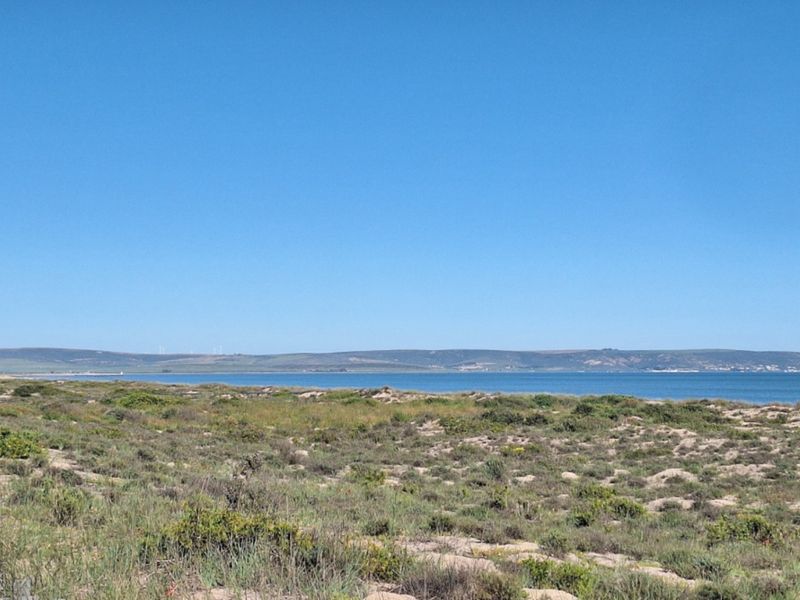 A scenic view of the coastline and ocean, showcasing the natural landscape and horizon.