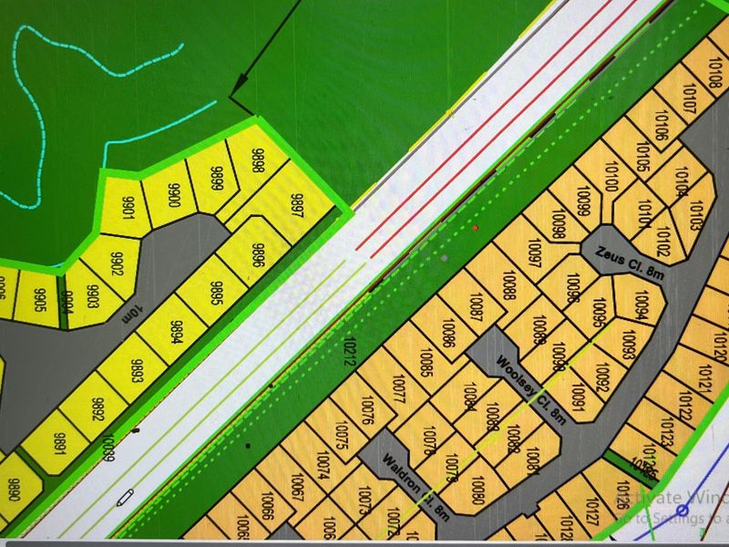 A digital site plan showing the layout of residential plots within the estate, including street names and individual lot numbering.