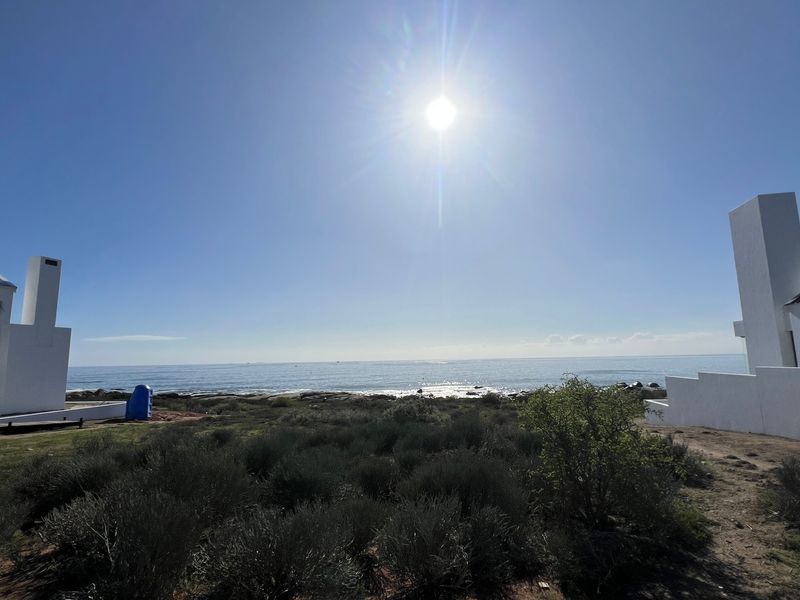 A scenic view of the ocean and coastline from the vacant residential property, showcasing the natural landscape and proximity to the sea.