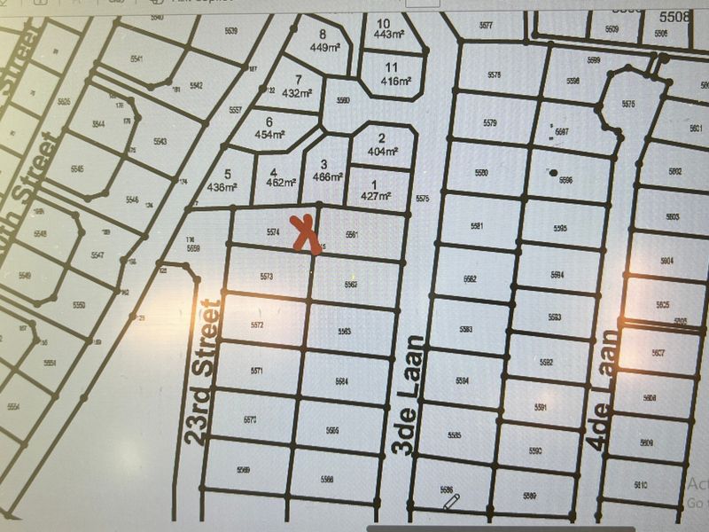 A digital cadastral map showing the layout and plot numbers of the residential estate, with a red mark indicating the specific property location.