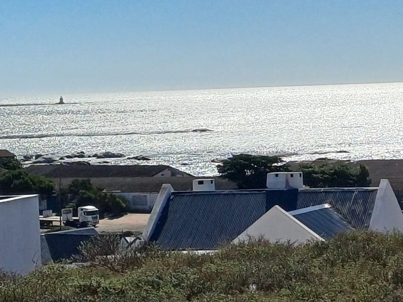 A scenic elevated view overlooking the ocean and coastline, capturing the horizon and surrounding landscape.