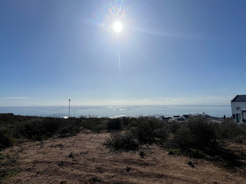 A scenic view of the ocean and coastal landscape from the vacant residential property.