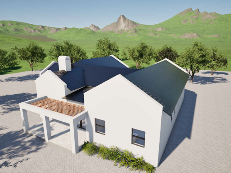 An aerial view of a modern residential property featuring a pitched roof, chimney, and a covered patio area set against a scenic mountain backdrop.
