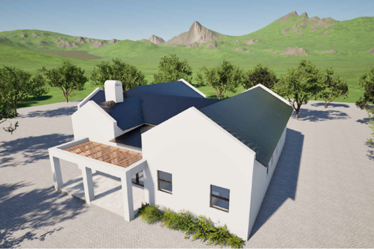 An aerial view of a modern residential property featuring a pitched roof, chimney, and a covered patio area set against a scenic mountain backdrop.