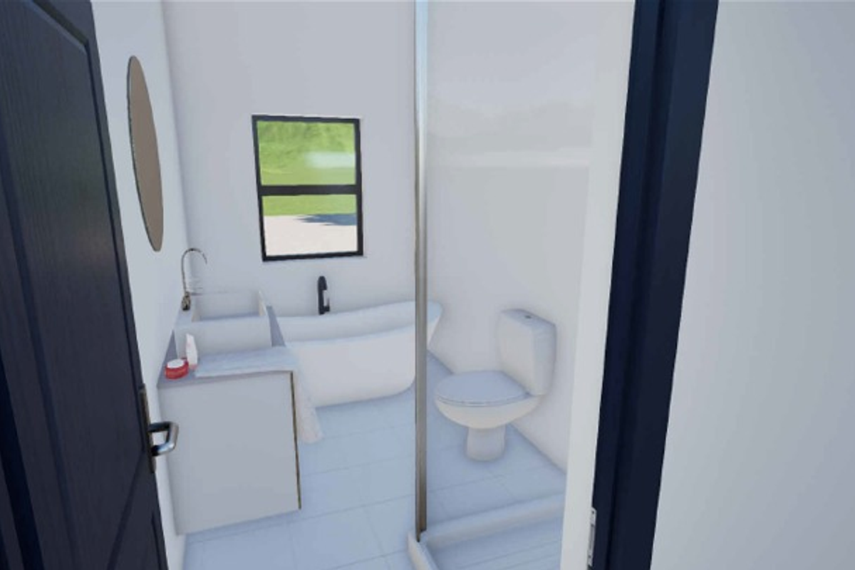A modern, minimalist bathroom featuring a freestanding bathtub, a vanity basin, a toilet, and a glass-enclosed shower.