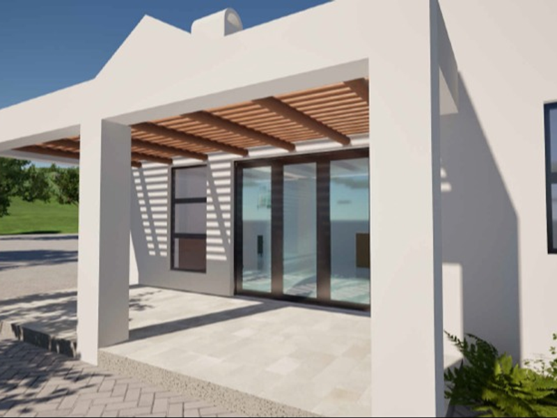 A modern covered patio featuring a timber pergola, stone paving, and large sliding glass doors providing seamless indoor-outdoor flow.
