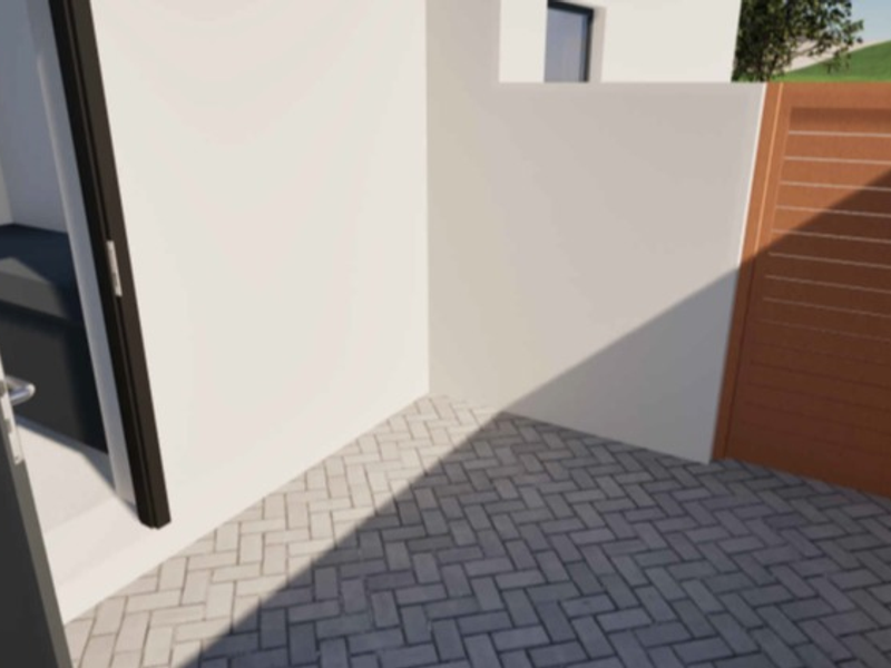 A clean, modern outdoor entrance area featuring herringbone paving, a timber gate, and a contemporary front door.