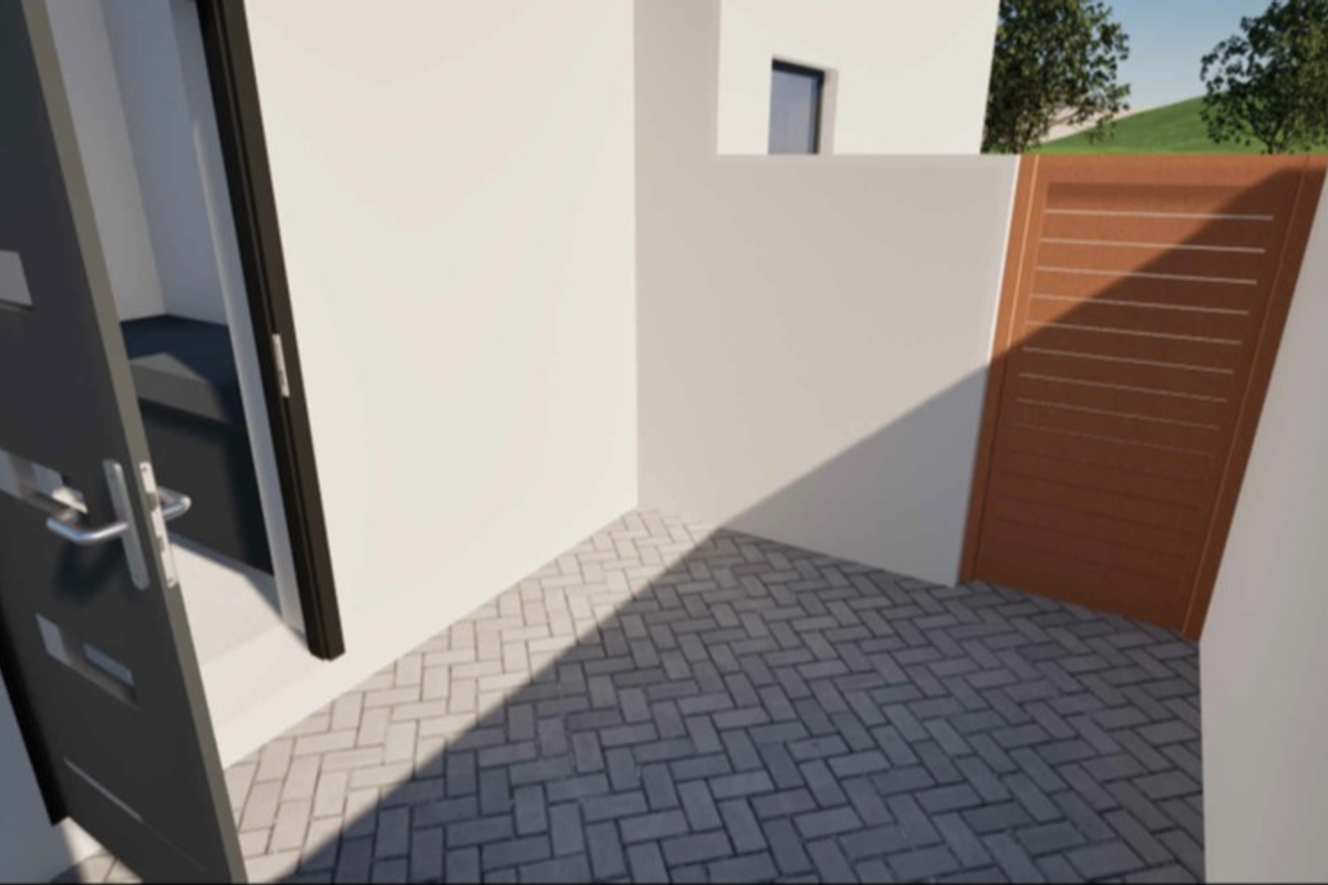 A clean, modern paved courtyard area featuring a timber slat gate and a contemporary entrance door.