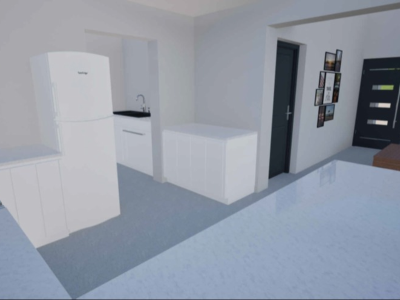 Modern open-plan kitchen area featuring stone countertops, built-in cabinetry, and a gas hob, seamlessly connected to the home entrance.